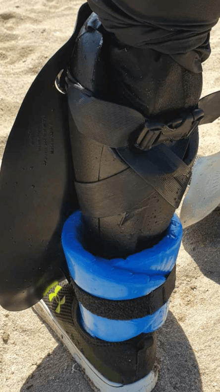 shinfin™ fin on above knee amputee prosthetic leg with ankle float for snorkeling: rear view