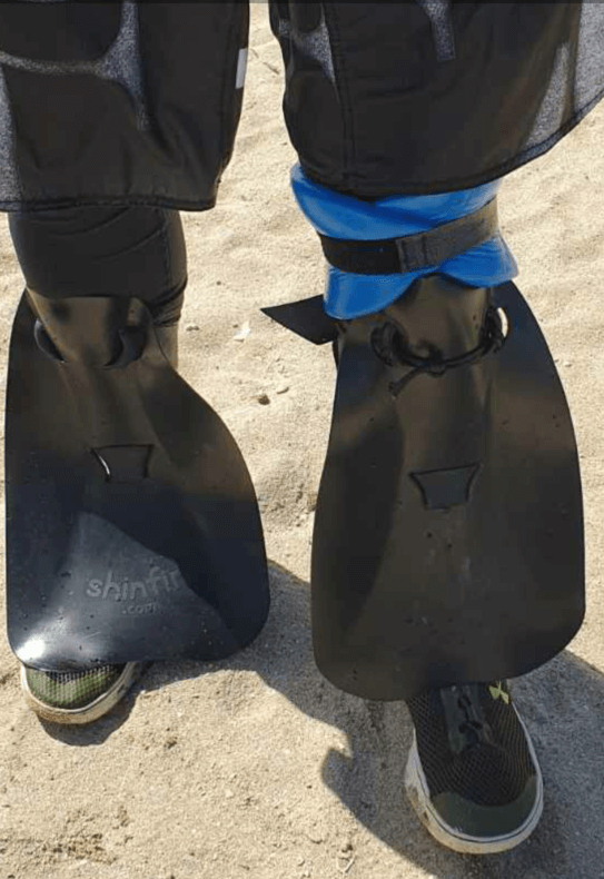 shinfin™ fin on above knee amputee prosthetic leg with leg float for snorkeling: front view